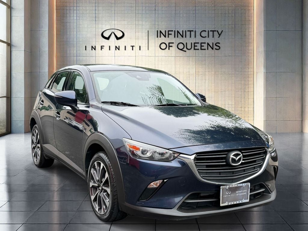 2019 Mazda Mazda CX-3 Touring in Deep Crystal Blue Mica — front three-quarter view